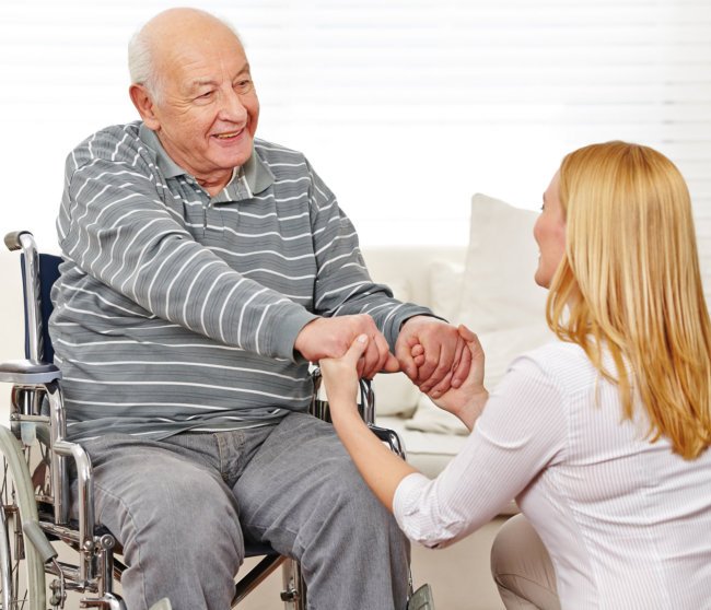 Woman holding hands with the senior